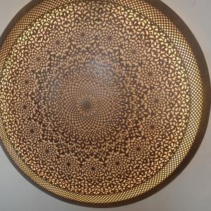 "A round copper artwork for wall decoration"